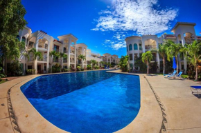 Second Floor Unit with views of the gardens and pool at Paseo del Sol by BRIC